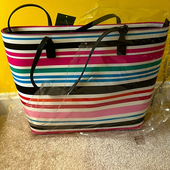 This Kate Spade Tote is Multi-Color; still has packing it.